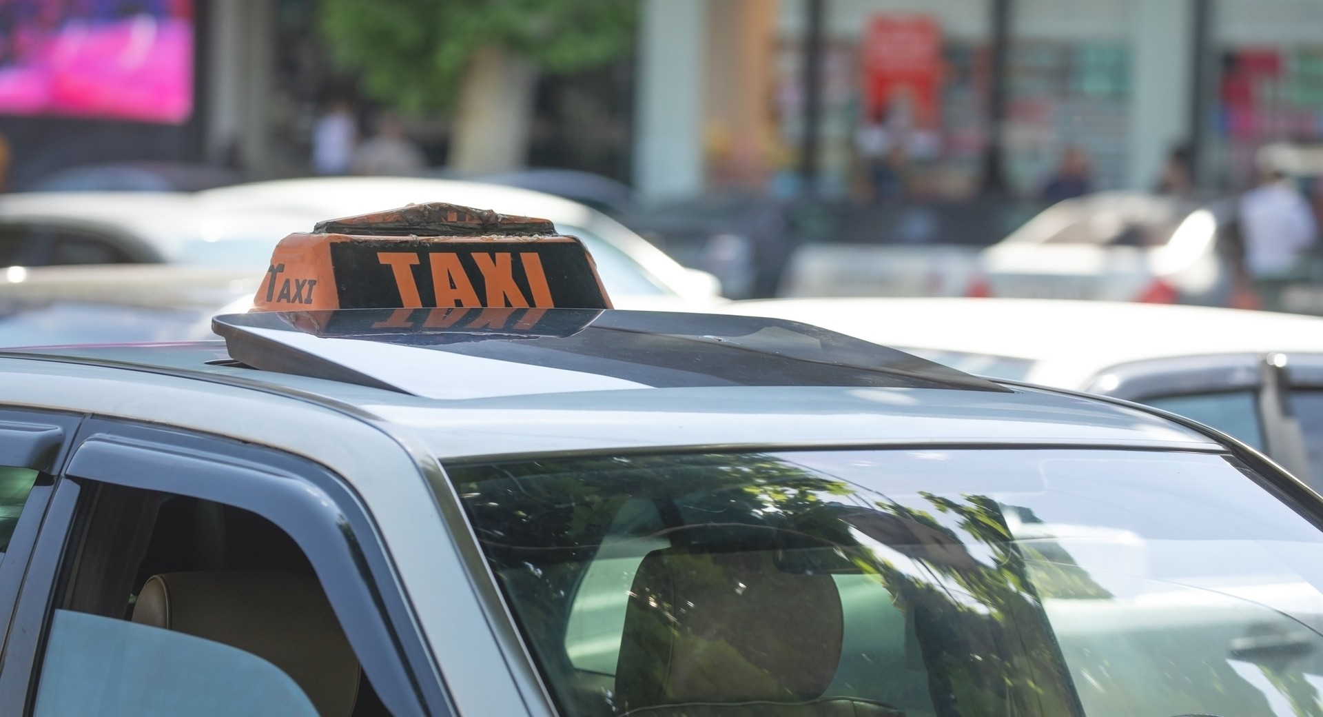 Taxi in the city street at summer.